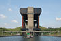 The boat lift of Strepy-Thieu , Hainaut, Belgium .With a height difference of 73.15 metres (240.0 ft) between the upstream and downstream reaches  of the Canal du Centre   which connects   the waterways of the Meuse and Scheldt rivers, it is the tallest boat lift in the world.