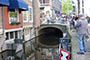 Photographing a small barrier in a Delft Canal.